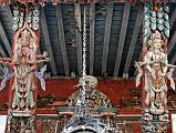 Kathmandu Patan 02-5 Rato Red Machhendranath Temple North Doorway Carved Multi Armed Figures On The Roof Struts 